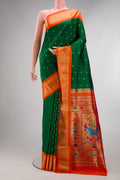 Pure Silk Bottle Green Dual Tone Paithani Saree with Zari Butta on the body and Zari Border.  displayed on a mannequin