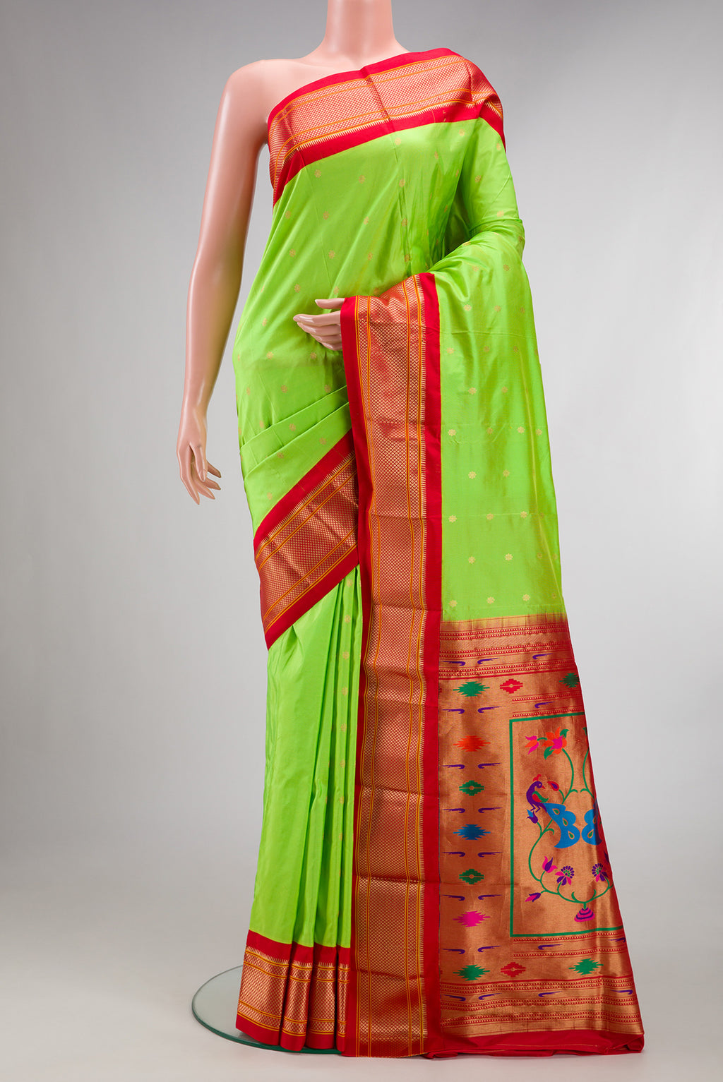 Pure Silk Parrot Green Paithani Saree with Zari Butta on the body and Zari Border.  displayed on a mannequin