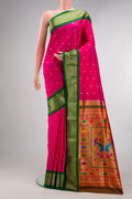 Pure Silk Dark Pink Paithani Saree with Zari Butta on the body and Zari Border.  displayed on a mannequin