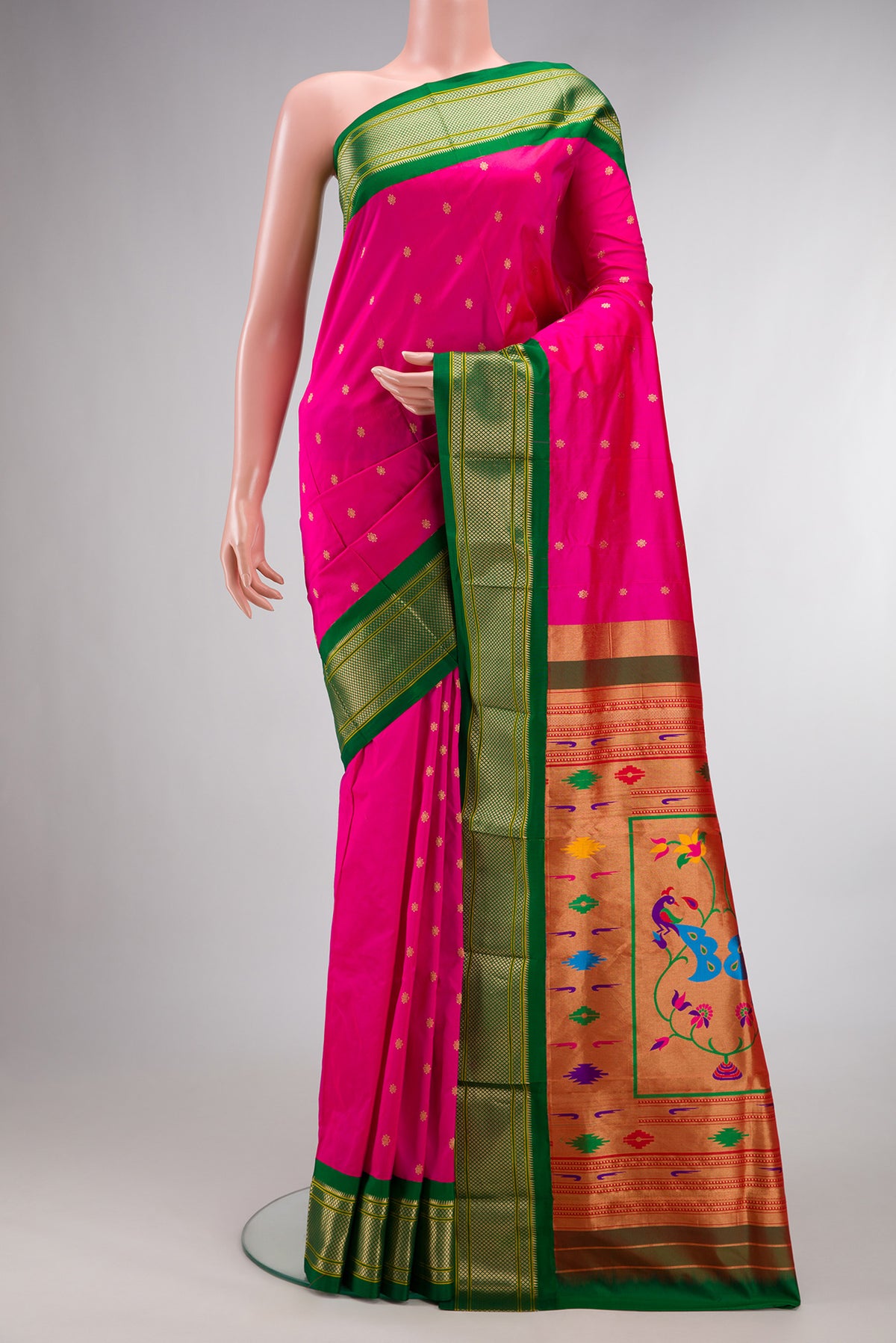 Pure Silk Pink Paithani Saree with Zari And Thread Butta on the body and Zari Border.  displayed on a mannequin
