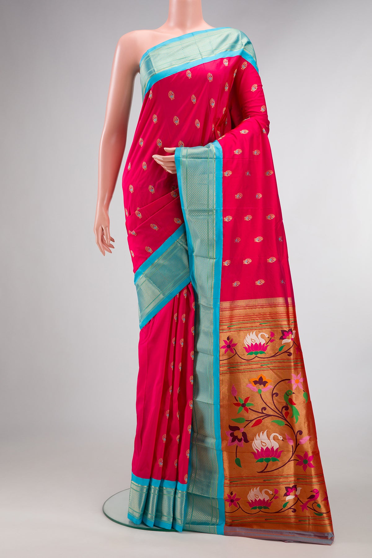 Pure Silk Pink Dual Tone Paithani Saree with Zari And Thread Butta on the body and Zari Border.  displayed on a mannequin