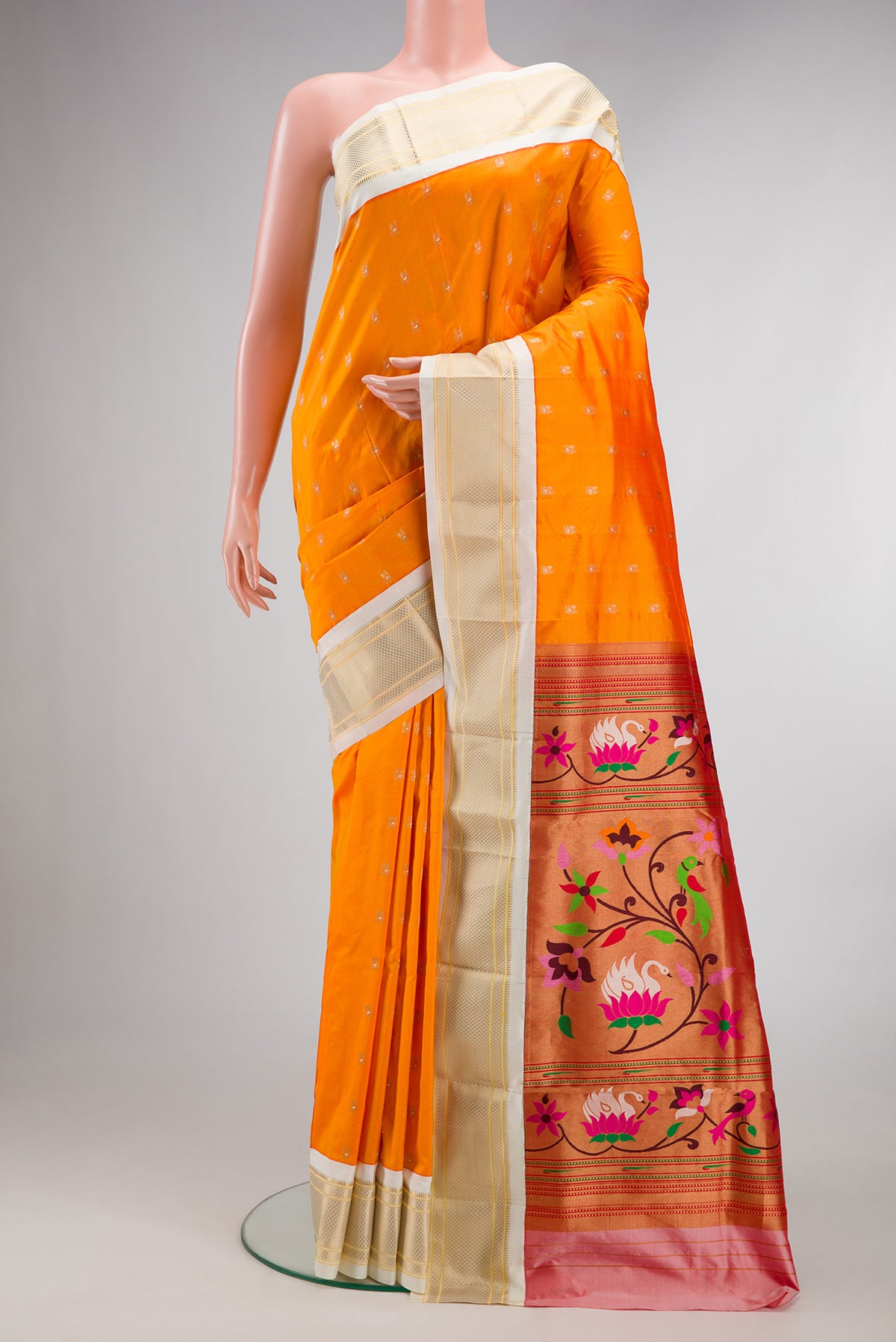 Pure Silk Orange Paithani Saree with Zari Butta on the body and Zari Border.  displayed on a mannequin