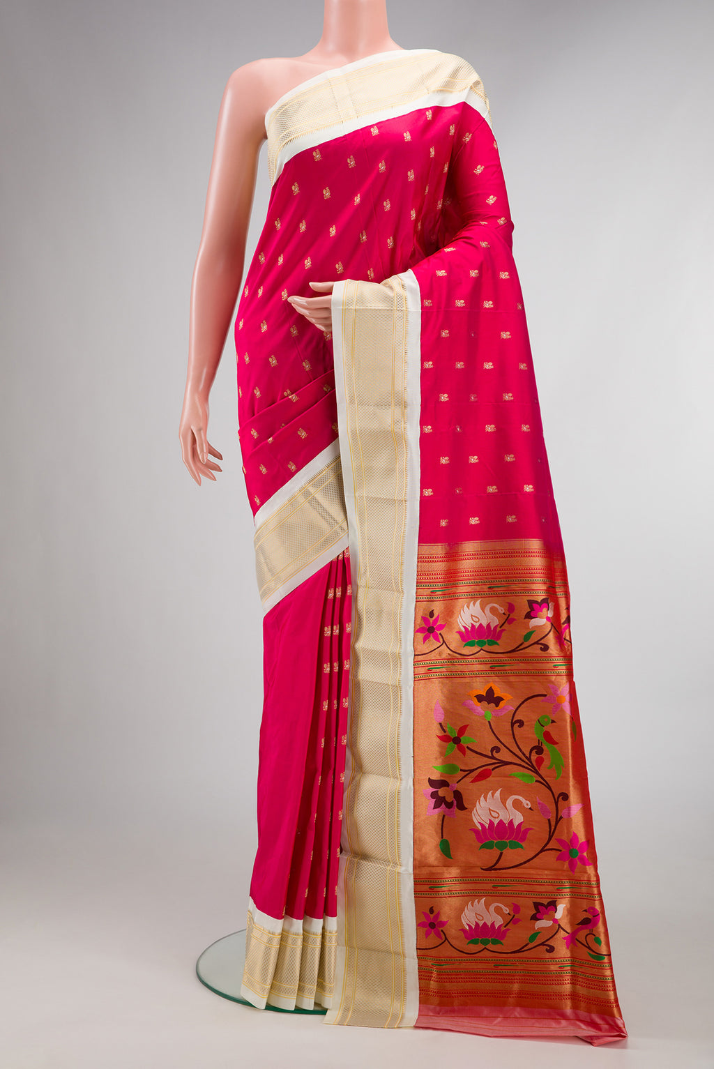 Pure Silk Dark Pink Paithani Saree with Zari Butta on the body and Zari Border.  displayed on a mannequin