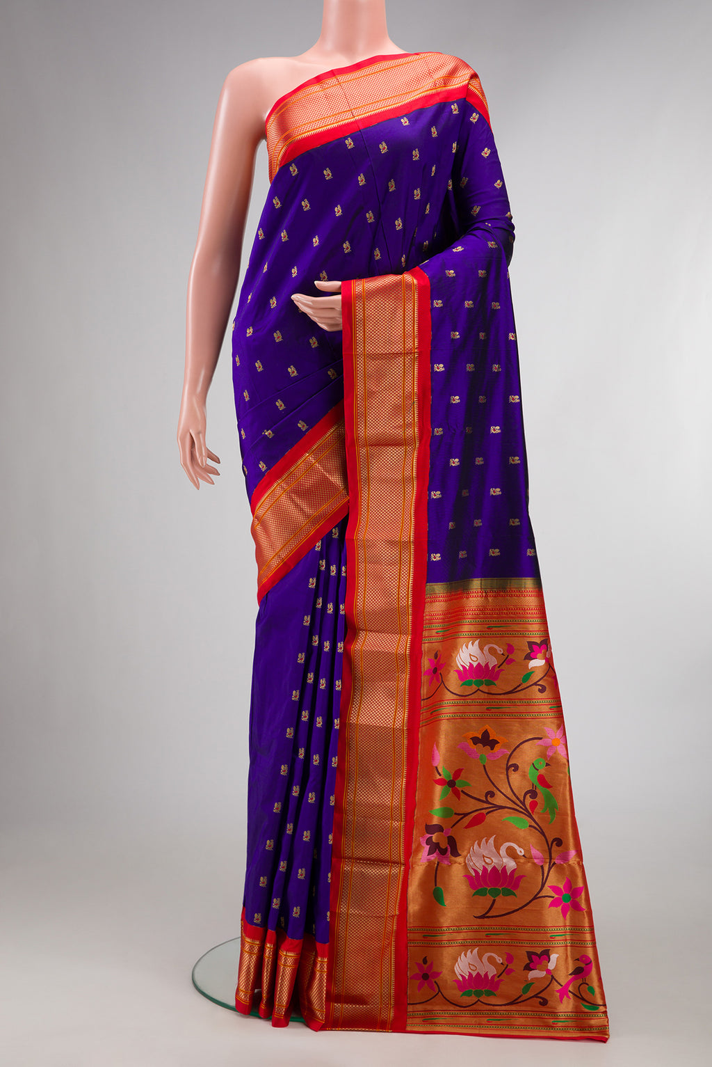 Pure Silk Royal Blue Paithani Saree with Zari And Thread Butta on the body and Zari Border.  displayed on a mannequin