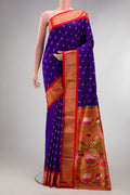 Pure Silk Royal Blue Paithani Saree with Zari And Thread Butta on the body and Zari Border.  displayed on a mannequin