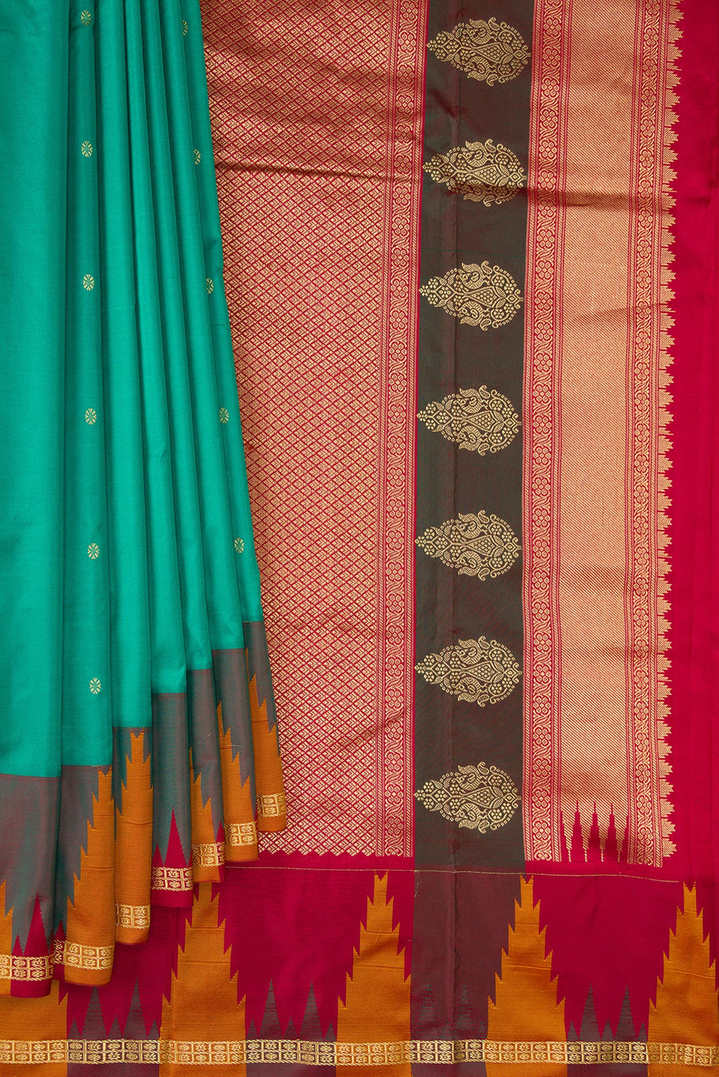 Pleats and pallu of Pure Silk Green Bangalore Saree with Zari Butta on the body and Temple Border. 