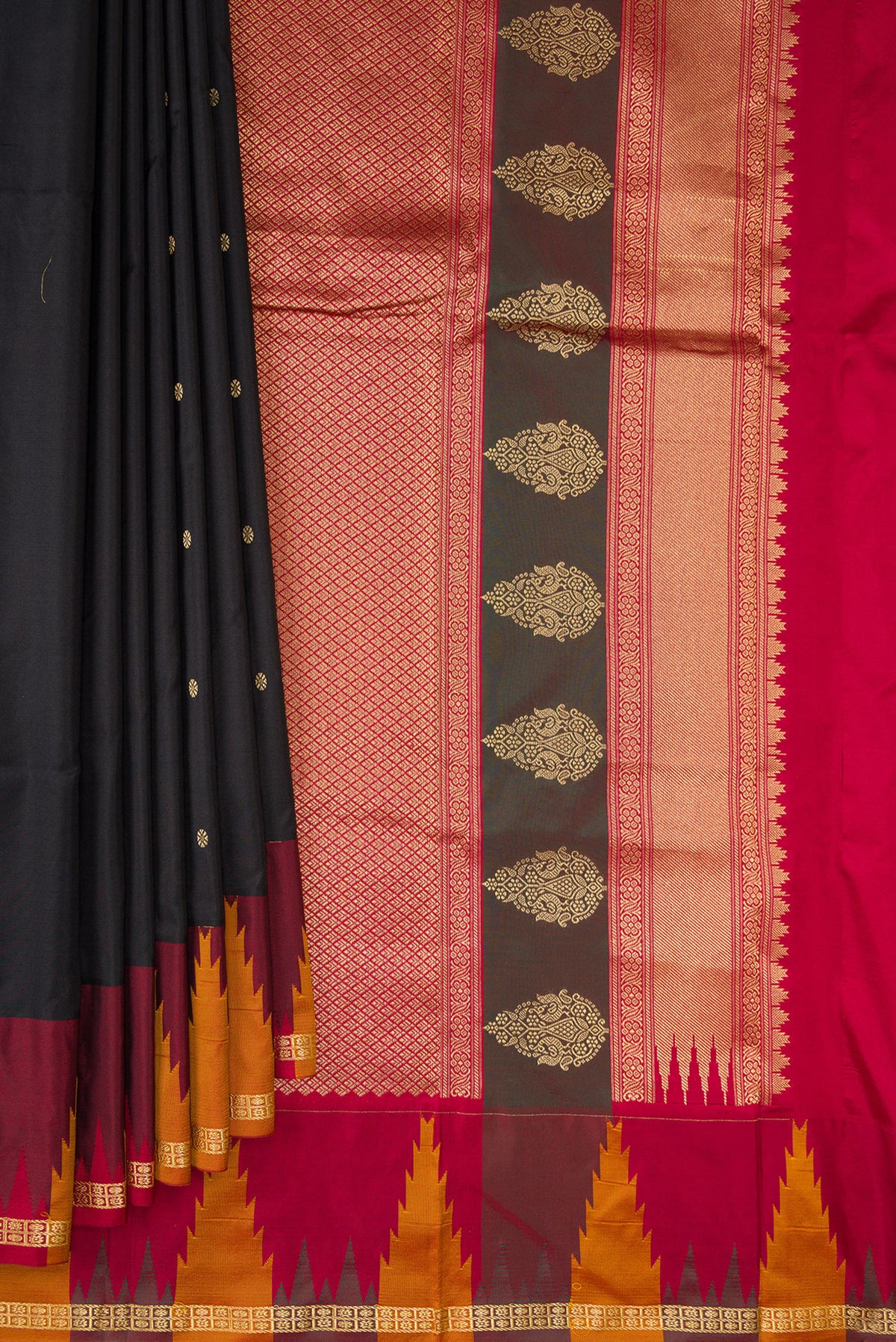 Pleats and pallu of Pure Silk Black Bangalore Saree with Zari Butta on the body and Temple Border. 