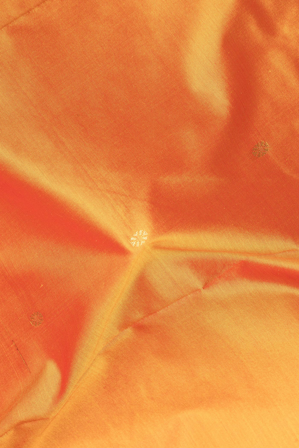 Close up of Pure Silk Yellow Bangalore Saree with Zari Butta on the body and Temple Border.  displaying folds