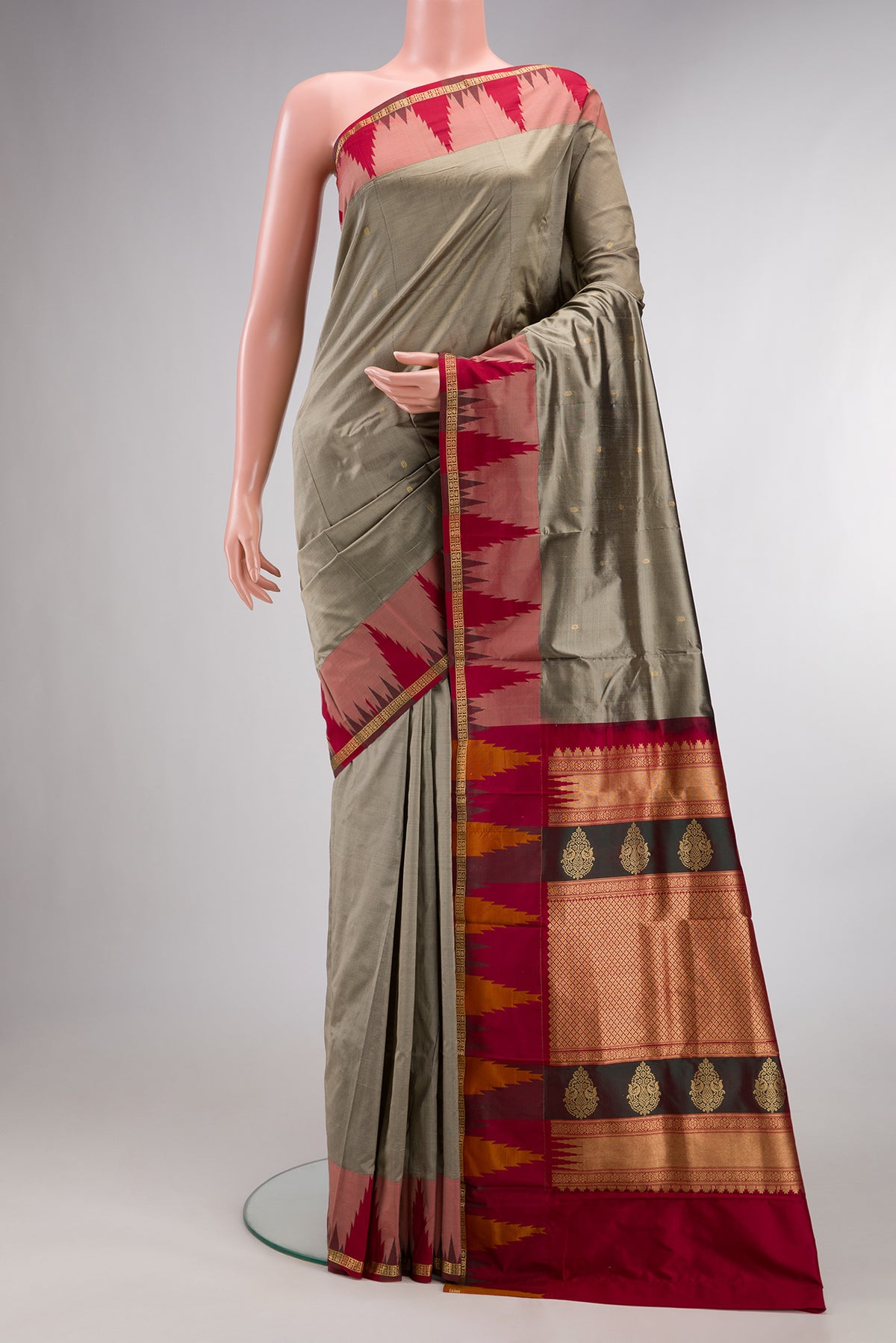 Pure Silk Grey Bangalore Saree with Zari Butta on the body and Temple Border.  displayed on a mannequin