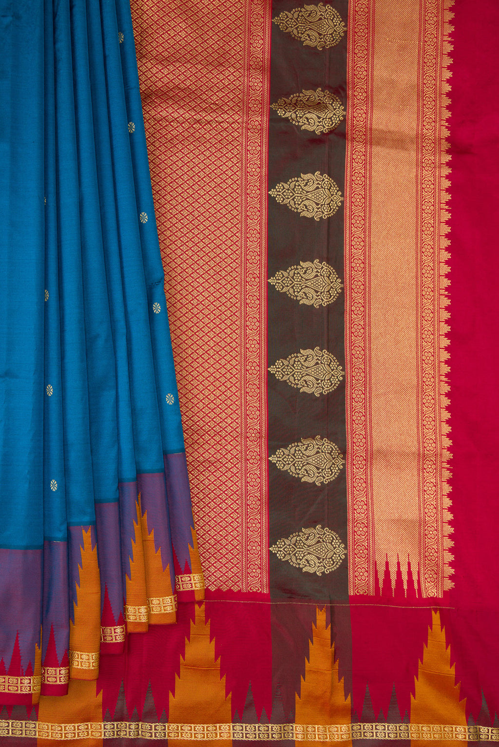 Pleats and pallu of Pure Silk Peacock Blue Bangalore Saree with Zari Butta on the body and Temple Border. 