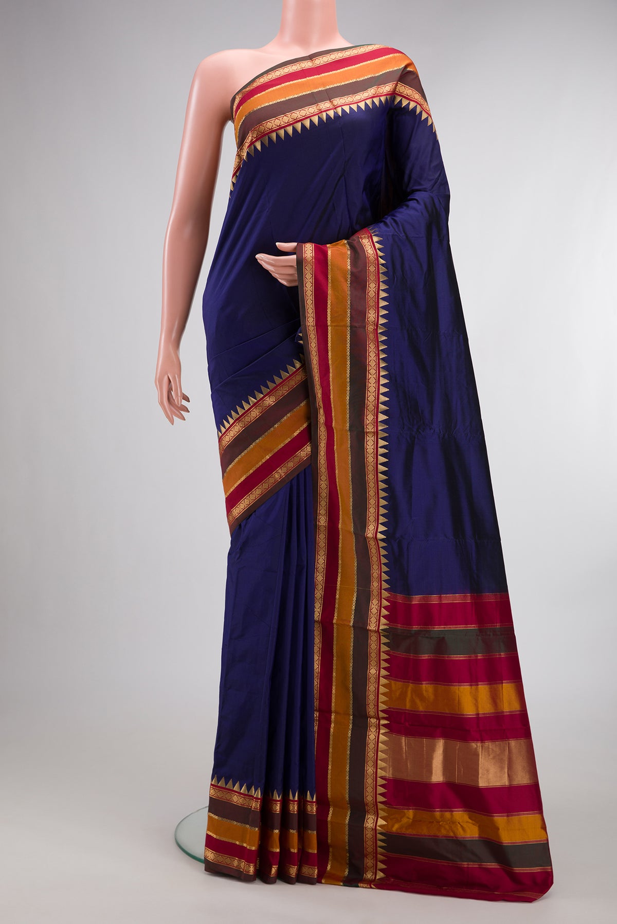Pure Silk Navy Blue Bangalore Saree with Plain Body and Temple Border.  displayed on a mannequin