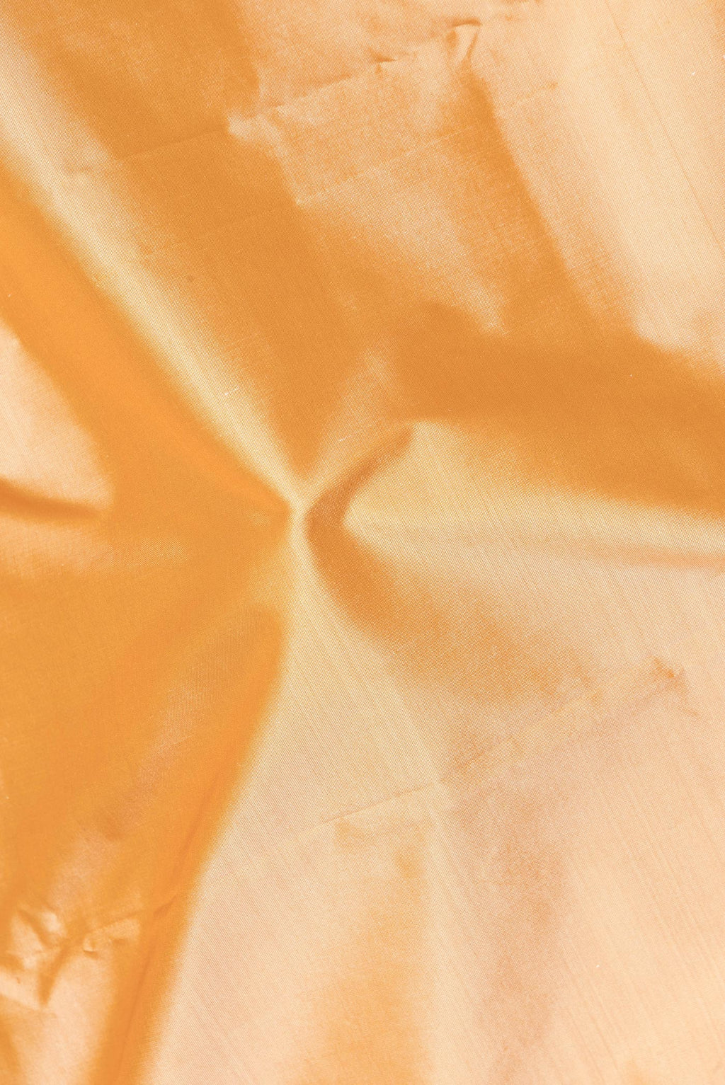 Close up of Pure Silk Sandal Bangalore Saree with Plain Body and Fancy Border.  displaying folds