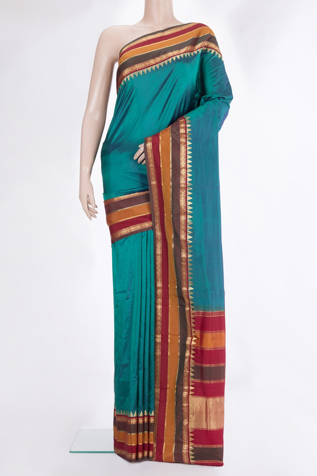 Pure Silk Peacock Blue Dual Tone Bangalore Saree with Plain Body and Fancy Border.  displayed on a mannequin