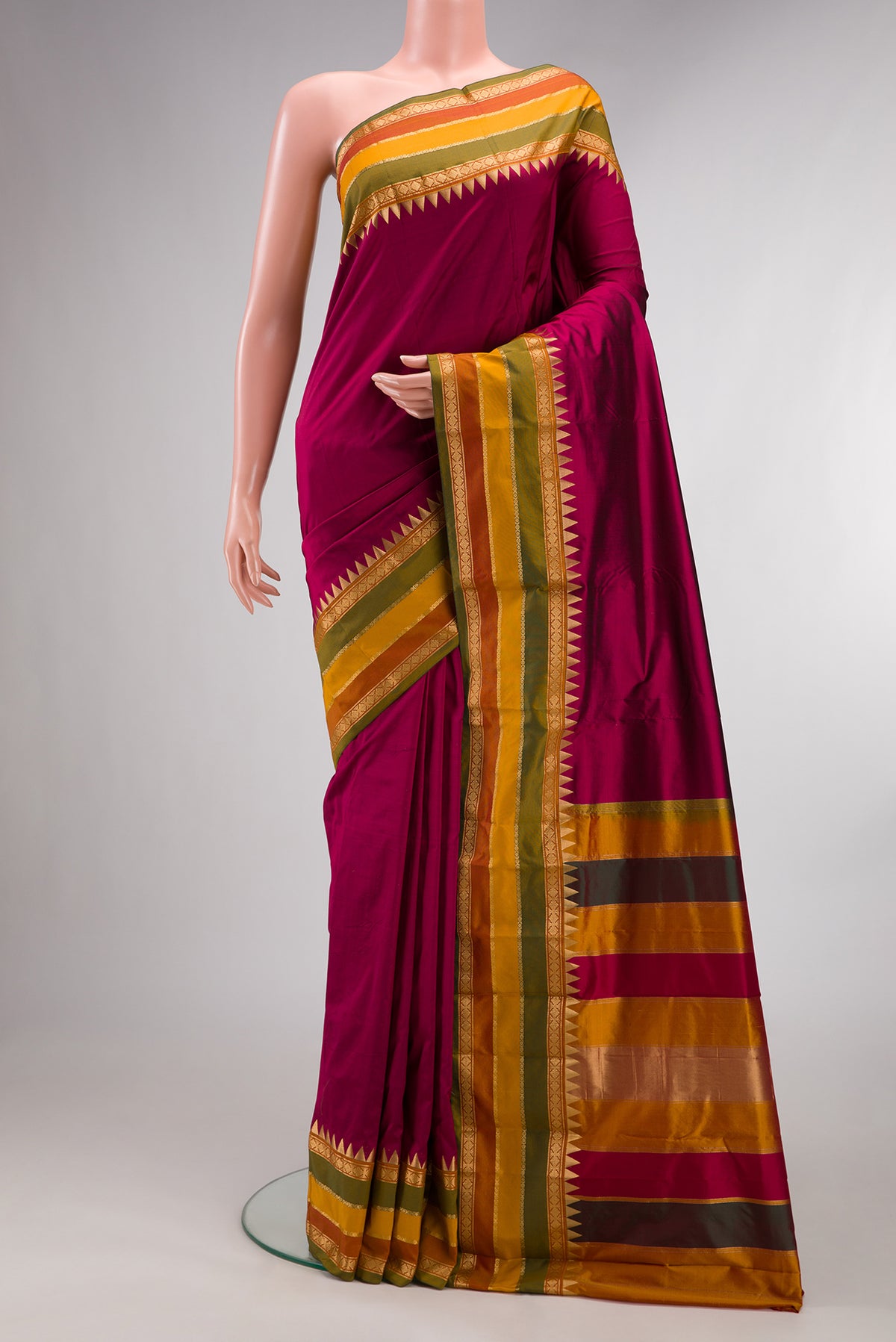 Pure Silk Maroon Bangalore Saree with Plain Body and Temple Border.  displayed on a mannequin
