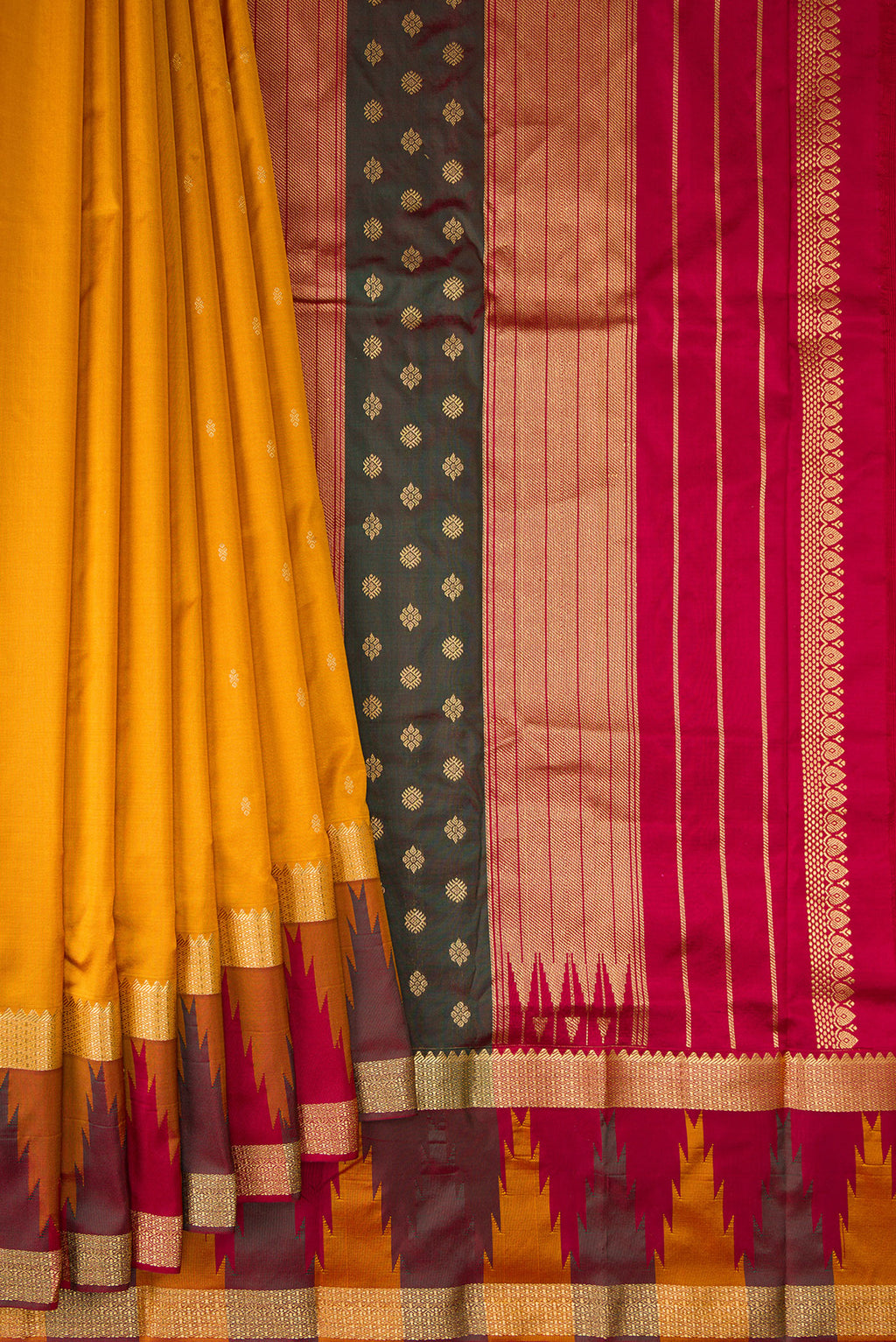 Pleats and pallu of Pure Silk Mustard Bangalore Saree with Zari Butta on the body and Temple Border. 