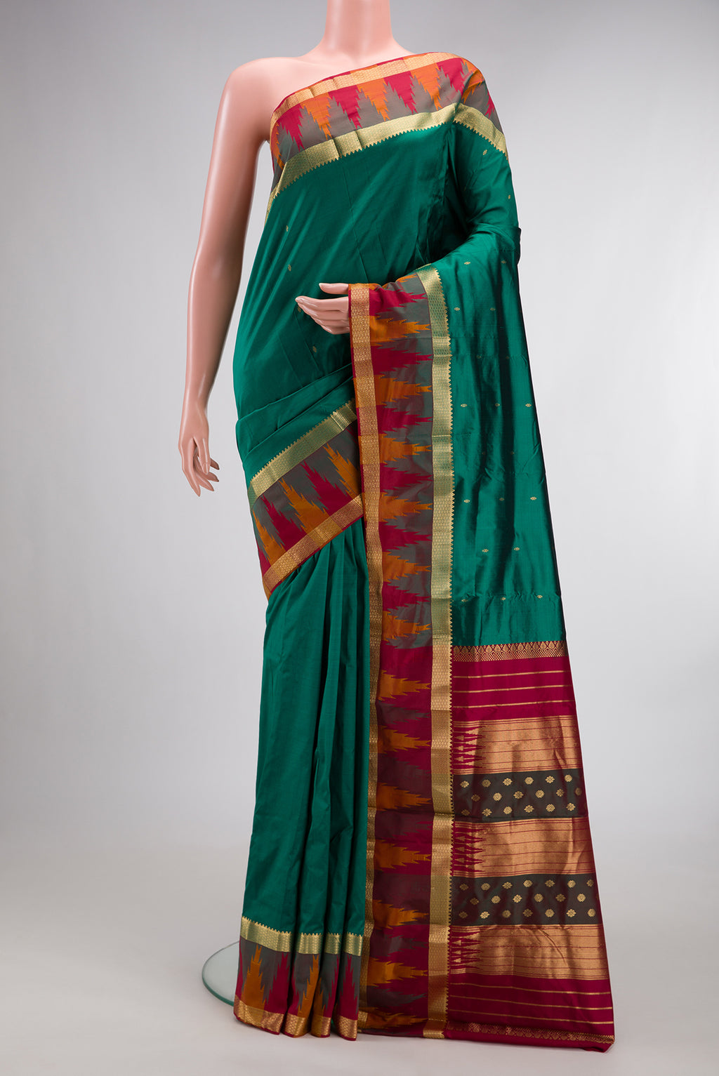Pure Silk Green Bangalore Saree with Zari Butta on the body and Temple Border.  displayed on a mannequin