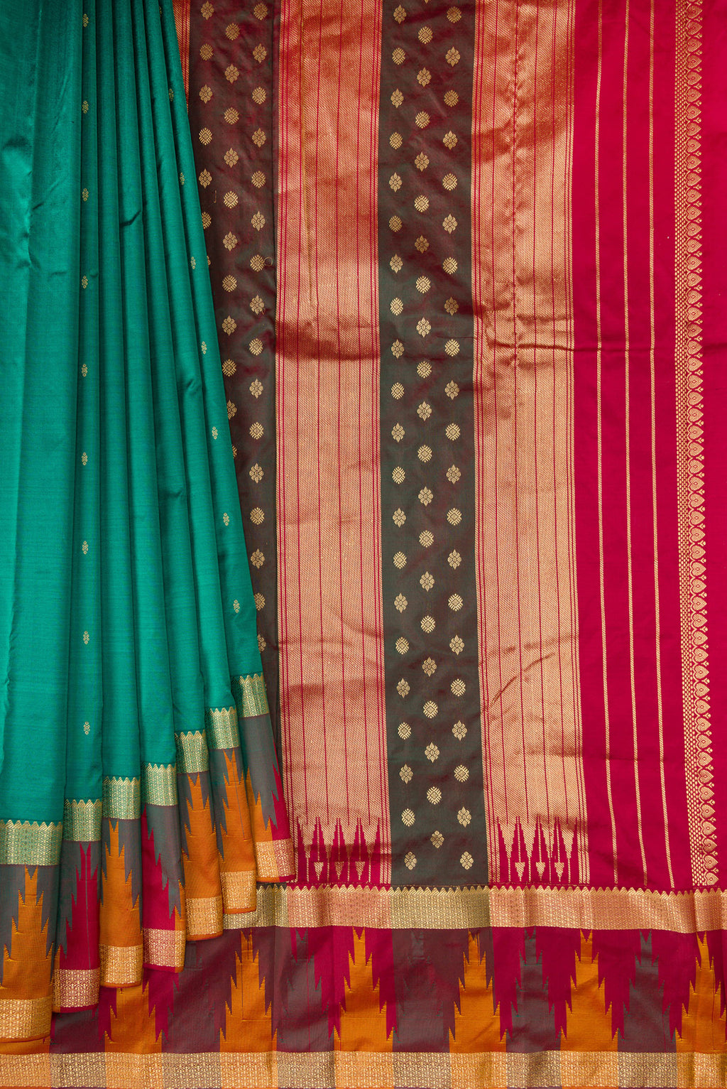 Pleats and pallu of Pure Silk Green Bangalore Saree with Zari Butta on the body and Temple Border. 