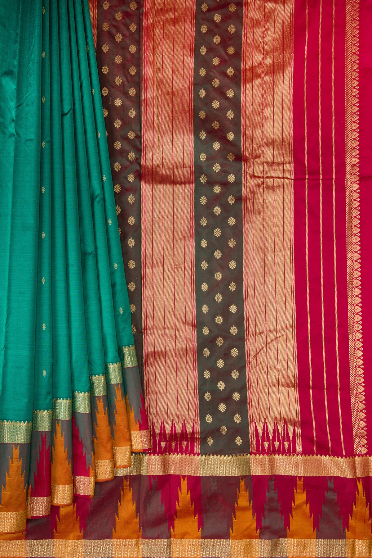 Pleats and pallu of Pure Silk Green Bangalore Saree with Zari Butta on the body and Temple Border. 