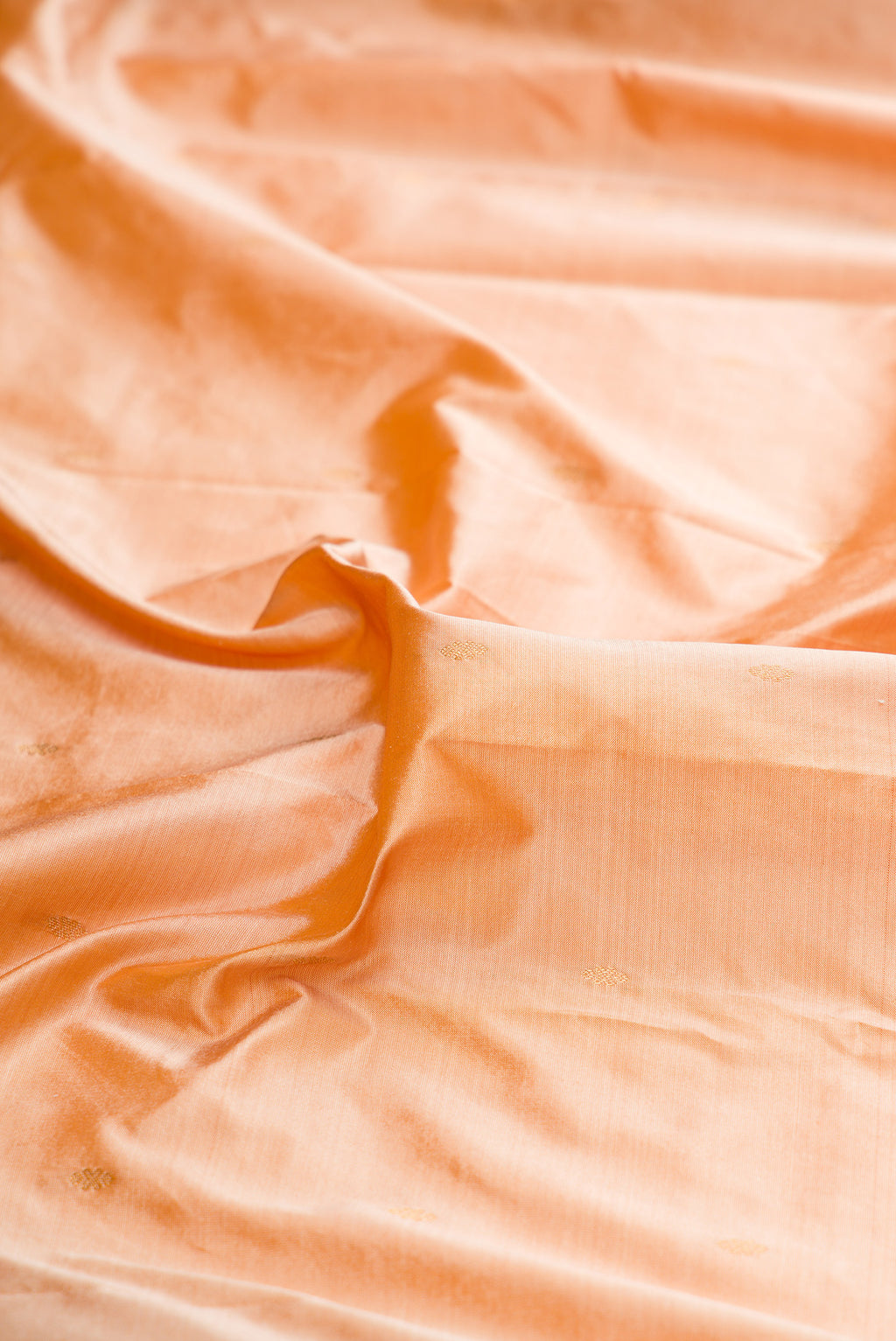 Close up of Pure Silk Sandal Bangalore Saree with Zari Butta on the body and Temple Border.  displaying folds