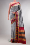 Pure Silk Grey Bangalore Saree with Zari Butta on the body and Temple Border.  displayed on a mannequin