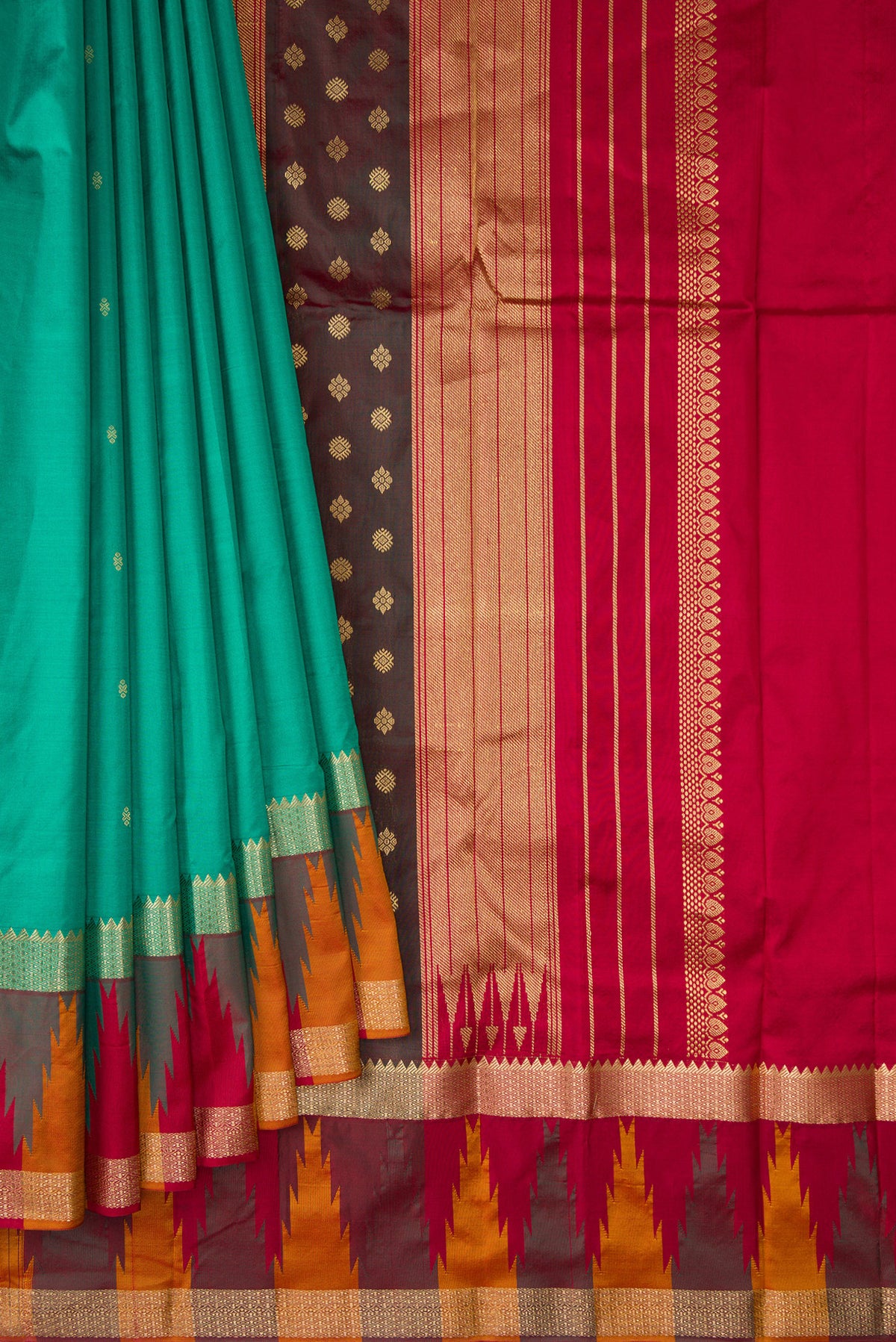 Pleats and pallu of Pure Silk Green Bangalore Saree with Zari Butta on the body and Temple Border. 