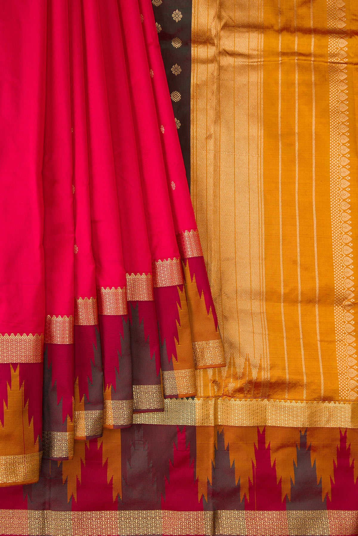 Pleats and pallu of Pure Silk Red Bangalore Saree with Zari Butta on the body and Temple Border. 