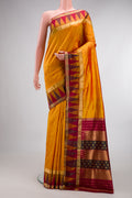 Pure Silk Mustard Dual Tone Bangalore Saree with Zari Butta on the body and Temple Border.  displayed on a mannequin