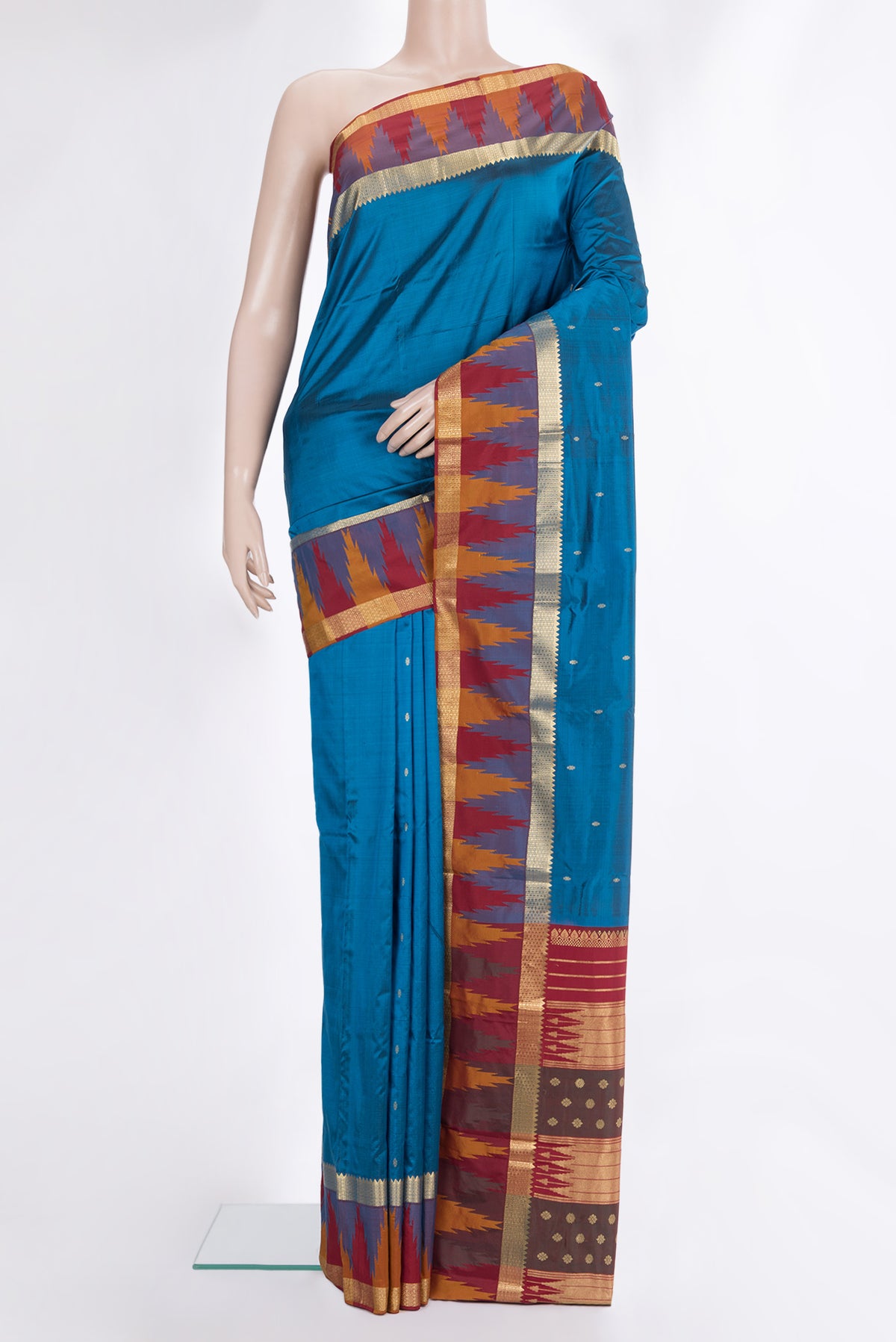 Pure Silk Peacock Blue Bangalore Saree with Zari Butta on the body and Temple Border.  displayed on a mannequin