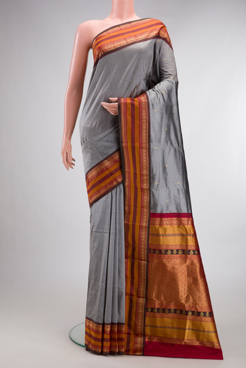 Pure Silk Grey Bangalore Saree with Zari Butta on the body and Zari Border.  displayed on a mannequin
