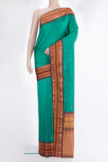Pure Silk Green Bangalore Saree with Zari Butta on the body and Zari Border.  displayed on a mannequin