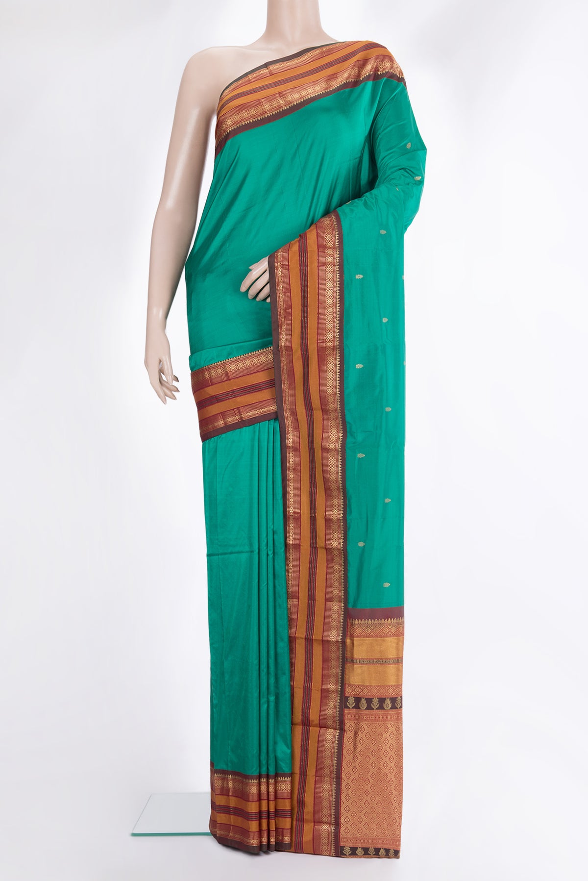 Pure Silk Green Bangalore Saree with Zari Butta on the body and Zari Border.  displayed on a mannequin
