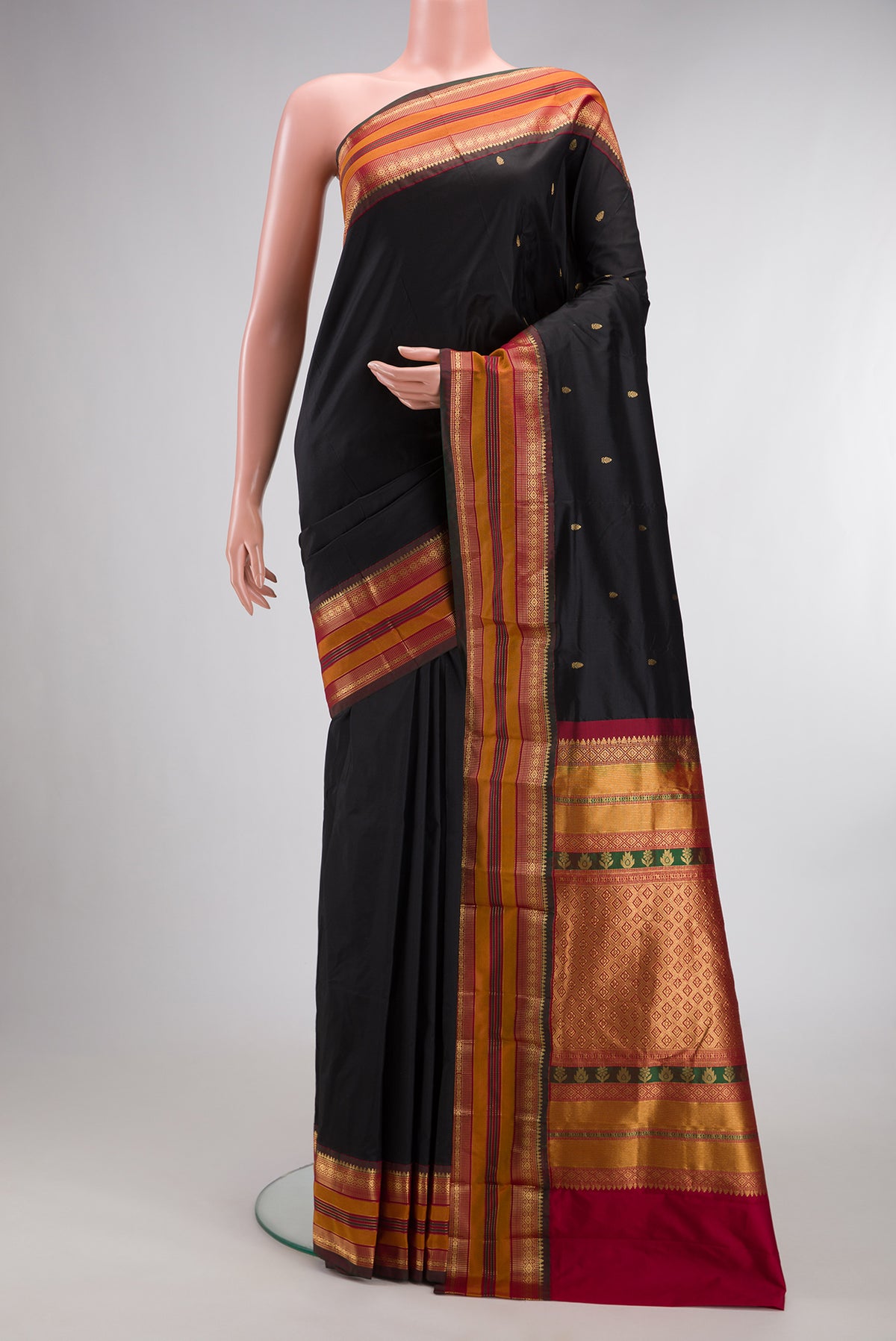 Pure Silk Black Bangalore Saree with Zari Butta on the body and Zari Border.  displayed on a mannequin