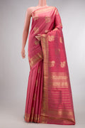 Pure Silk Coral Kanjivaram Saree with Zari Butta on the body and Zari Border.  displayed on a mannequin