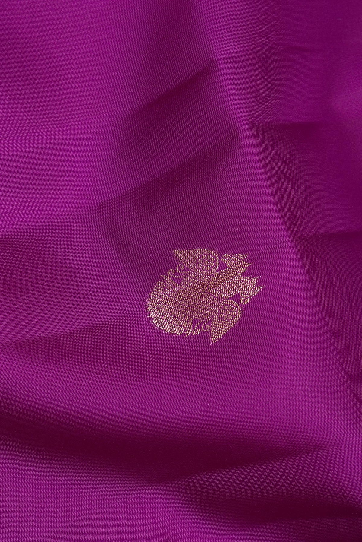 Close up of Pure Silk Purple Kanjivaram Saree with Zari Butta on the body and Zari Border.  displaying folds