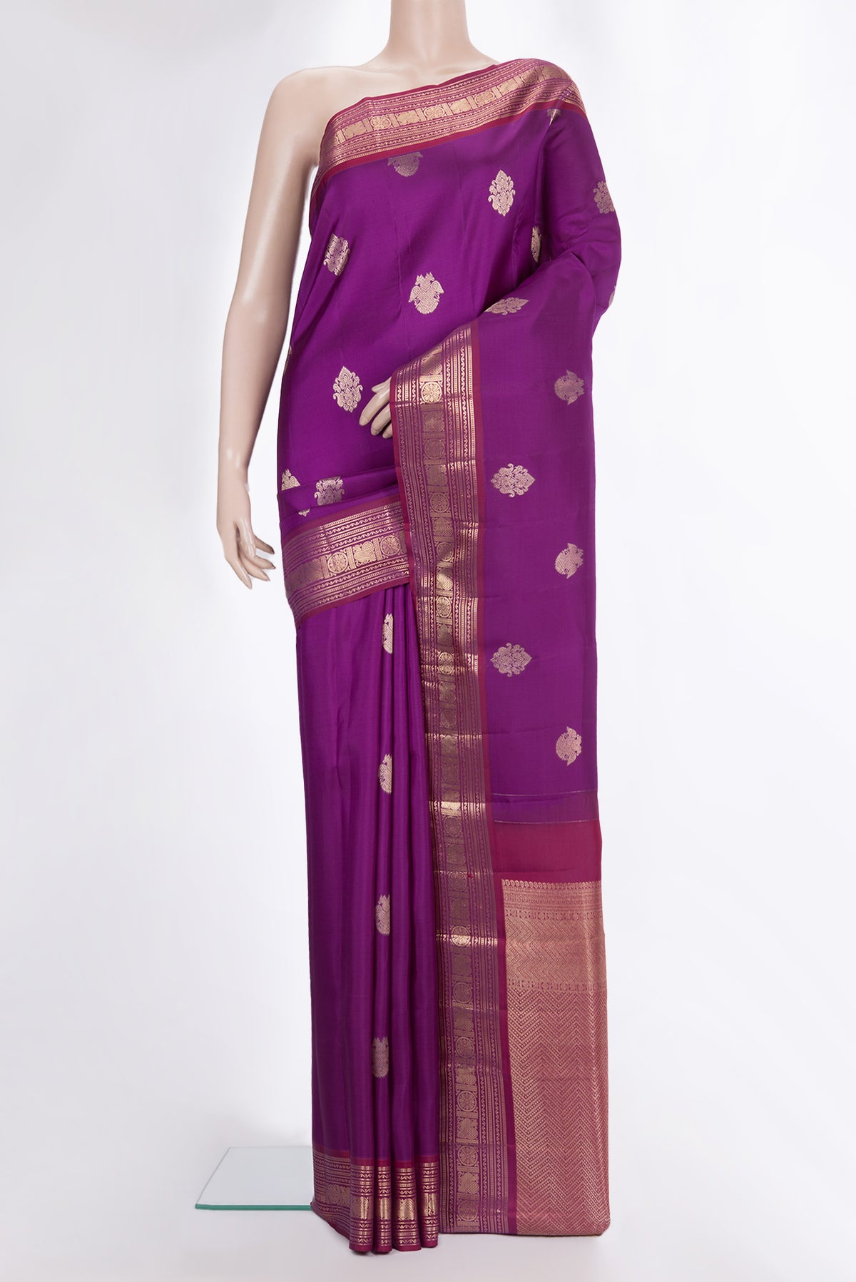 Pure Silk Purple Kanjivaram Saree with Zari Butta on the body and Zari Border.  displayed on a mannequin
