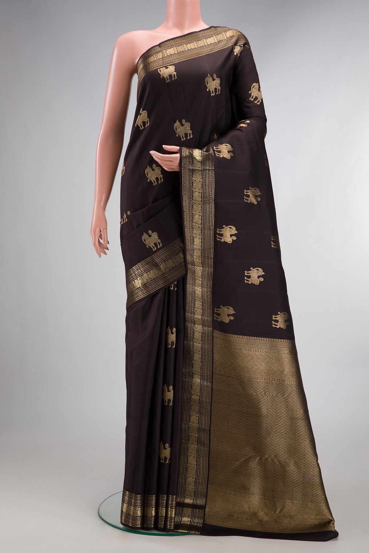 Pure Silk Coffee Brown Kanjivaram Saree with Zari Butta on the body and Zari Border.  displayed on a mannequin