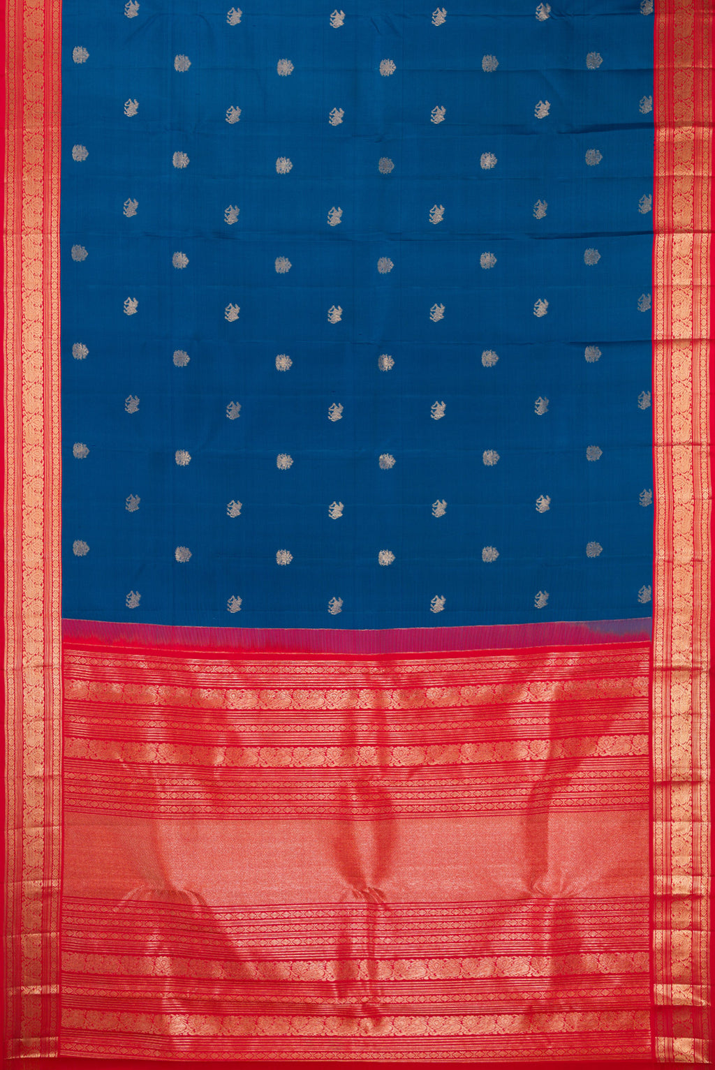Flat view of Pure Silk Blue Kanchipuram Saree with Zari Butta on the body and Zari Border. 