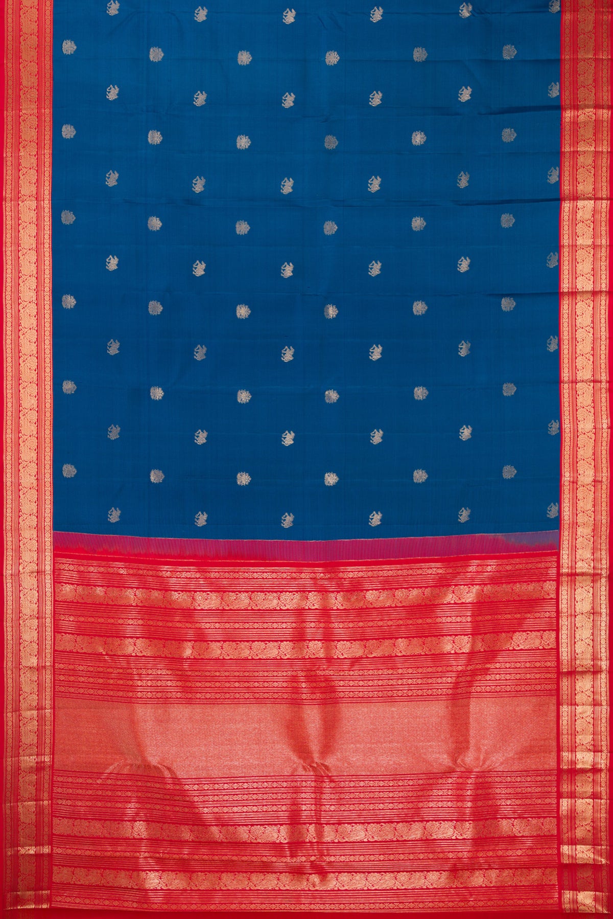 Flat view of Pure Silk Blue Kanchipuram Saree with Zari Butta on the body and Zari Border. 