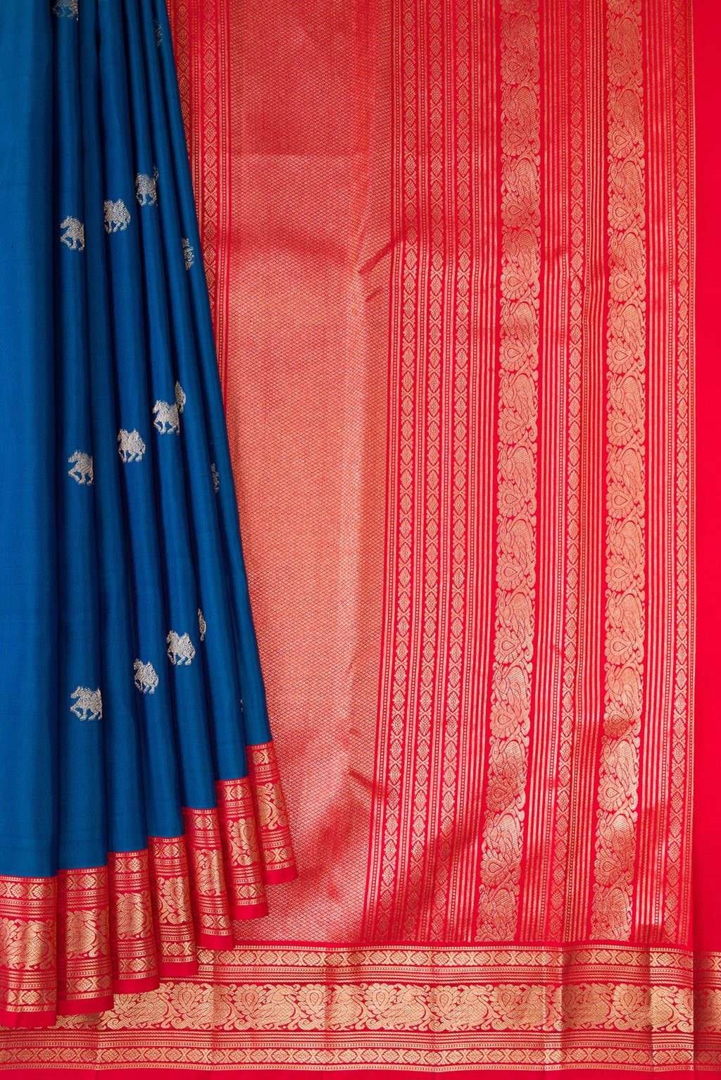 Pleats and pallu of Pure Silk Blue Kanchipuram Saree with Zari Butta on the body and Zari Border. 