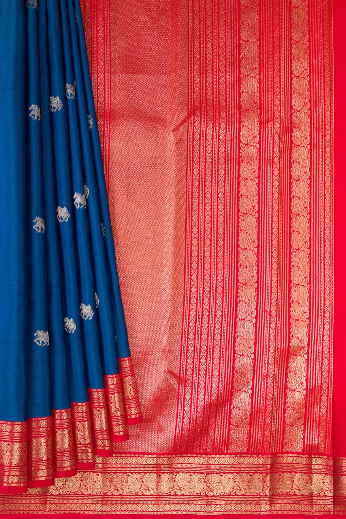 Pleats and pallu of Pure Silk Blue Kanchipuram Saree with Zari Butta on the body and Zari Border. 