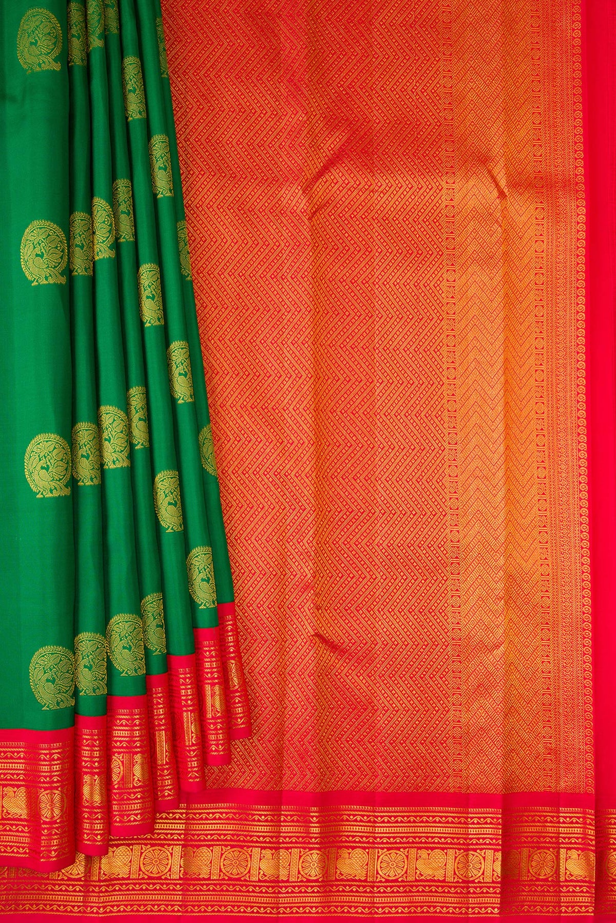 Pleats and pallu of Pure Silk Green Kanchipuram Saree with Zari Butta on the body and Zari Border. 