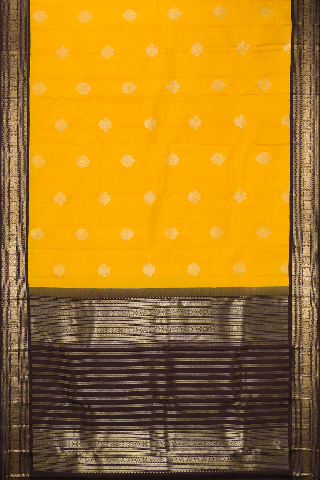 Flat view of Pure Silk Yellow Kanchipuram Saree with Zari Butta on the body and Zari Border. 