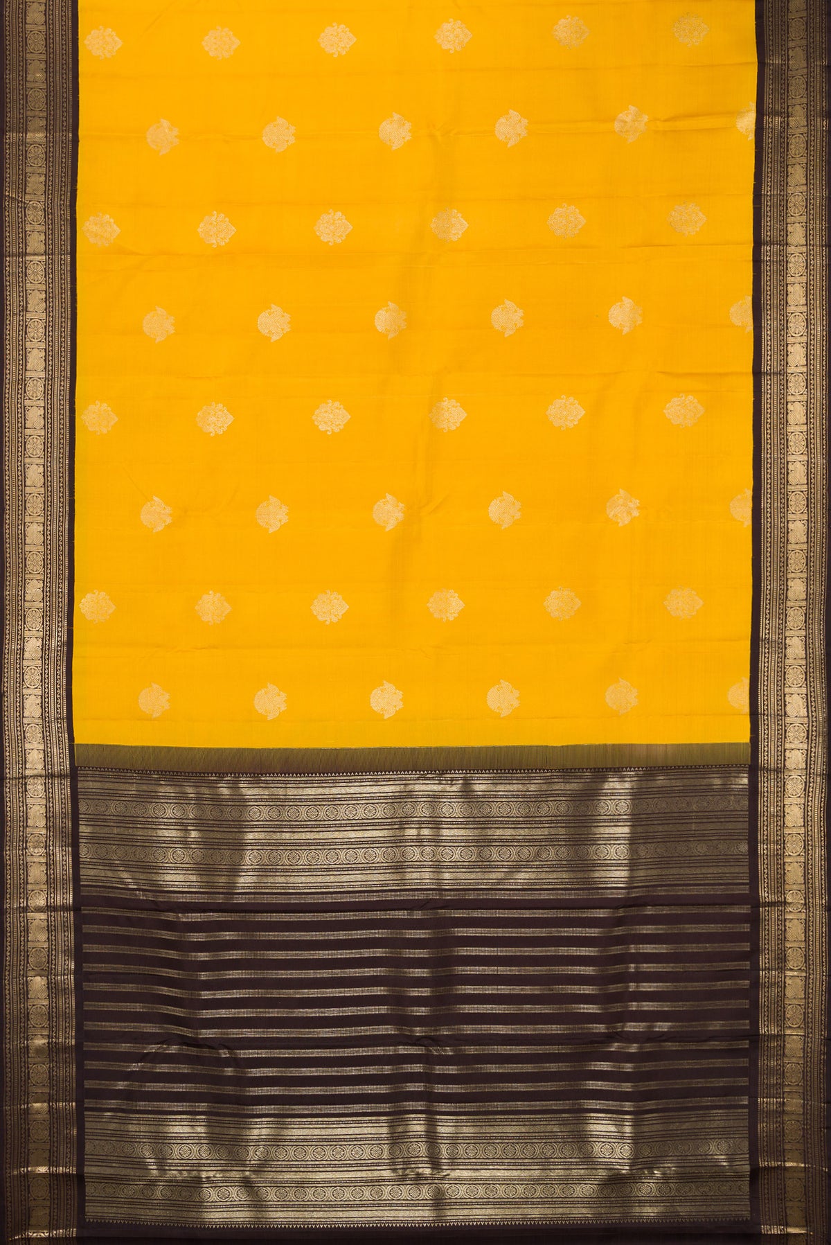 Flat view of Pure Silk Yellow Kanchipuram Saree with Zari Butta on the body and Zari Border. 