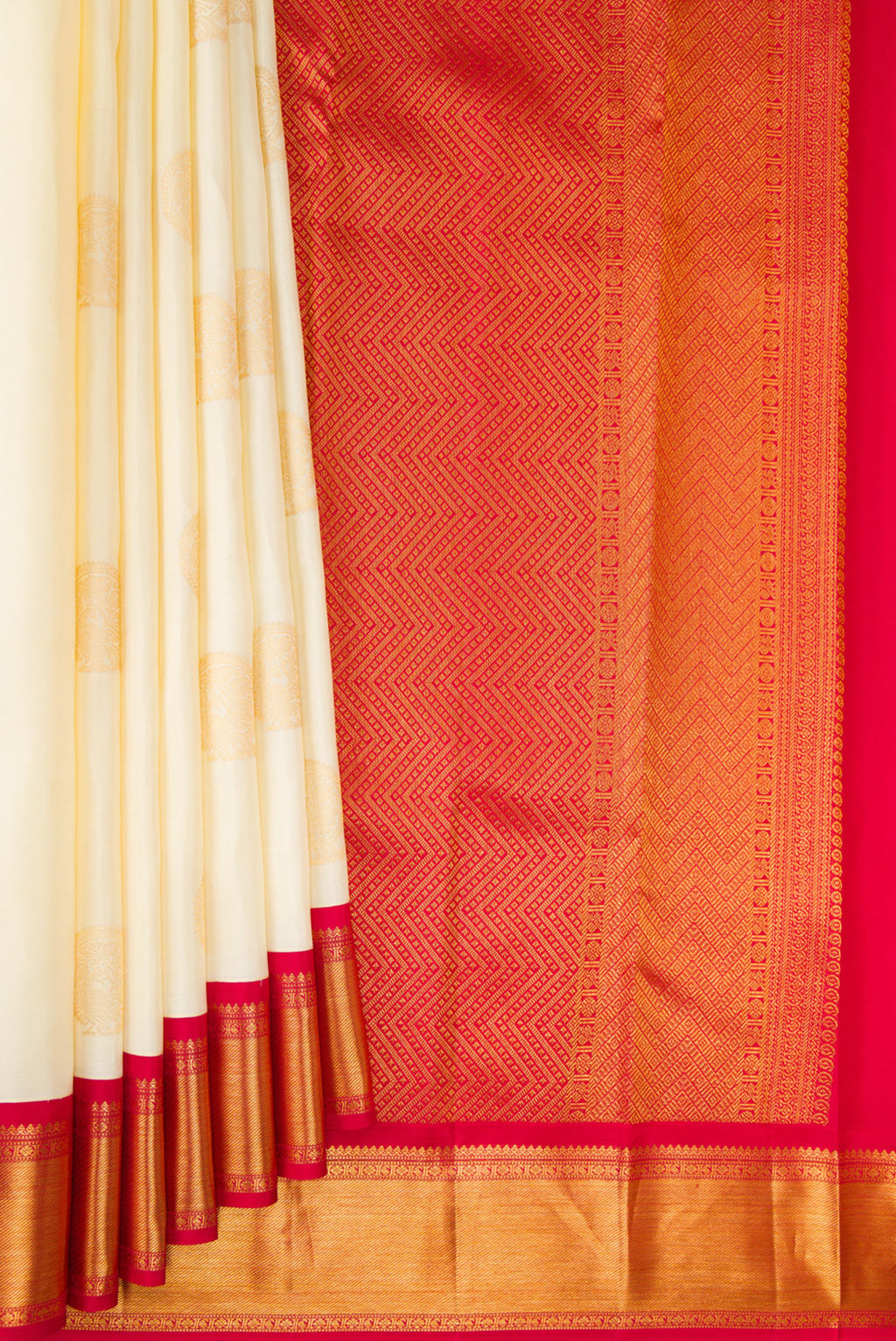 Pleats and pallu of Pure Silk Cream Kanchipuram Saree with Zari Butta on the body and Zari Border. 