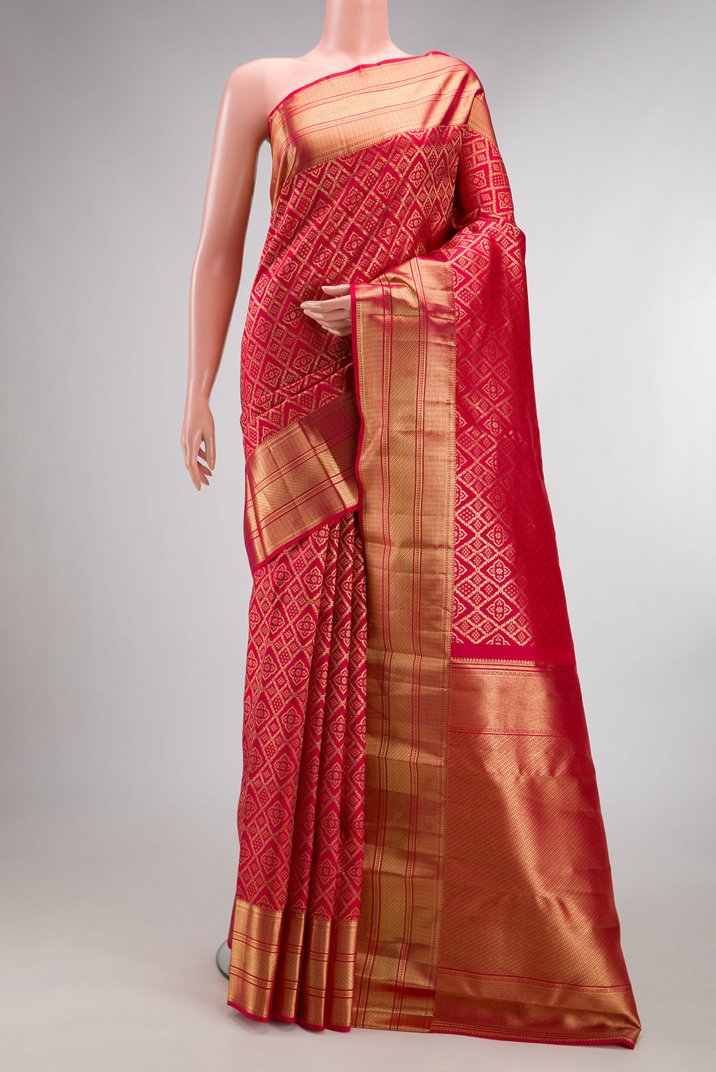 Pure Silk Dark Pink Dual Tone Kanchipuram Saree with Zari Brocade on the body and Zari Border.  displayed on a mannequin