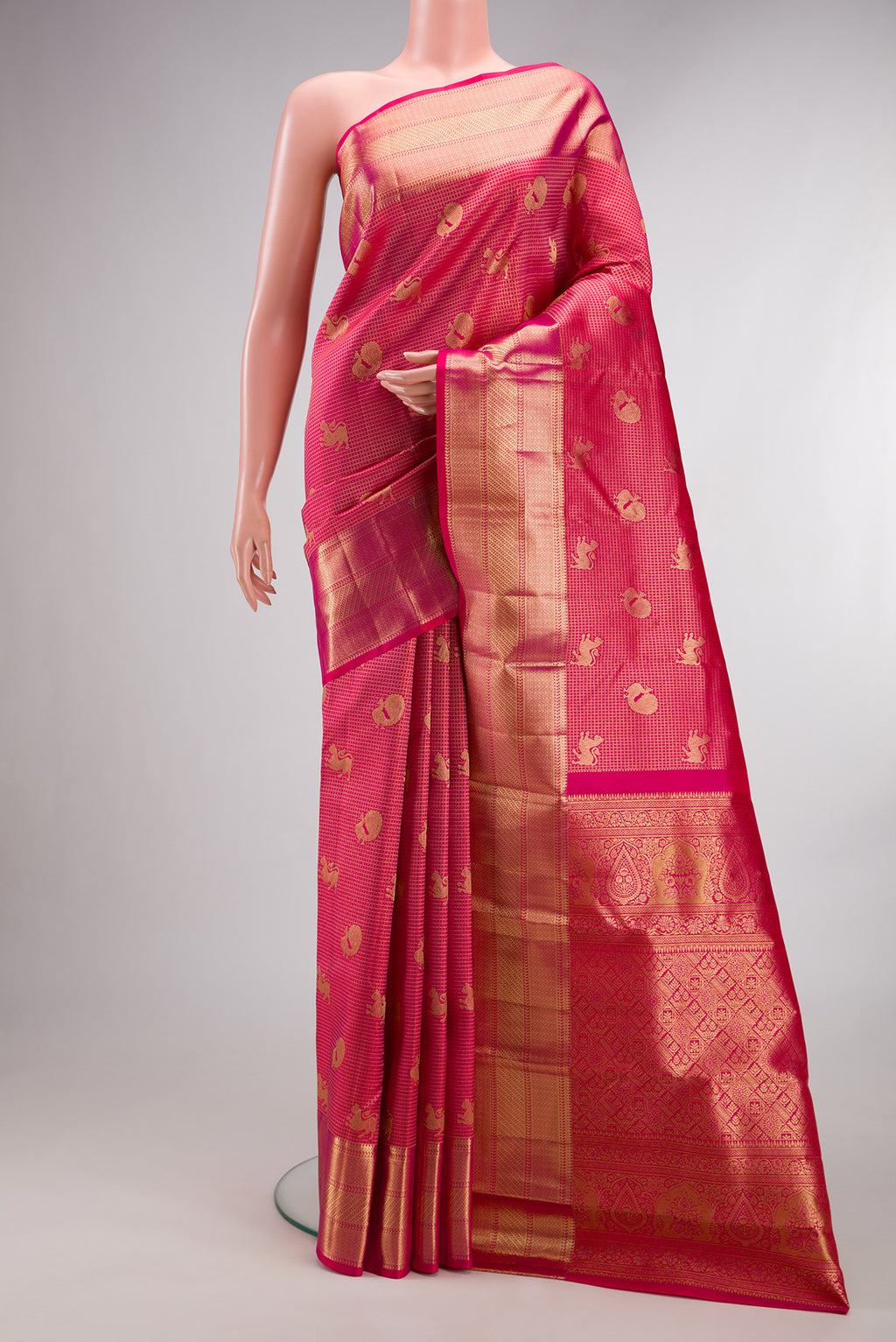 Pure Silk Dark Pink Dual Tone Kanchipuram Saree with Zari Brocade on the body and Zari Border.  displayed on a mannequin