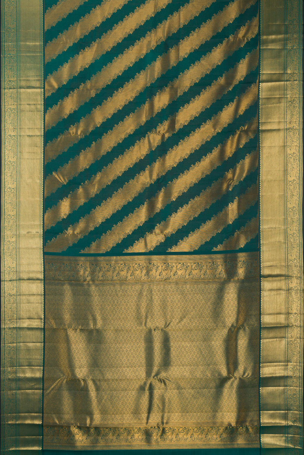 Flat view of Pure Silk Bottle Green Kanchipuram Saree with Zari Brocade on the body and Zari Border. 