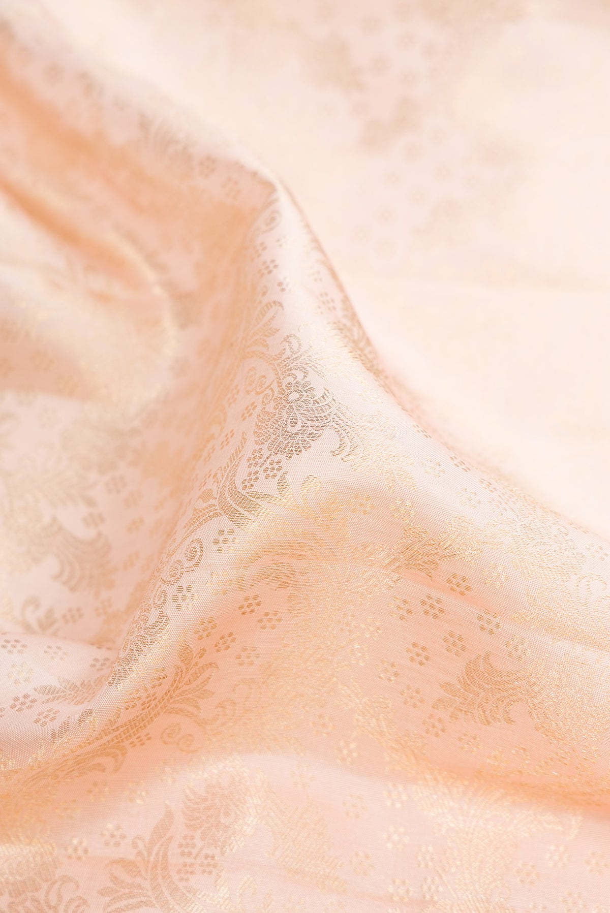 Close up of Pure Silk Sandal Kanchipuram Saree with Zari Brocade on the body and Zari Border.  displaying folds