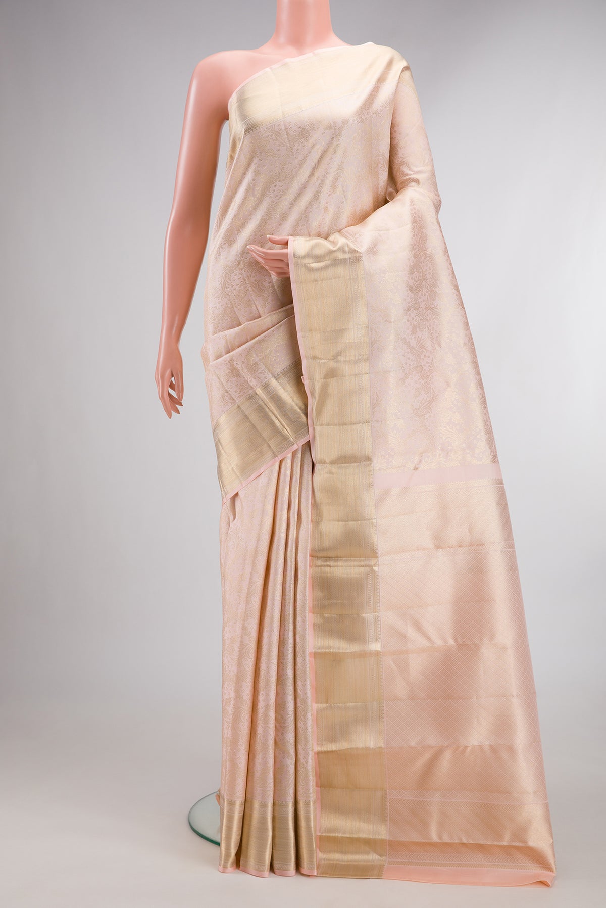 Pure Silk Sandal Kanchipuram Saree with Zari Brocade on the body and Zari Border.  displayed on a mannequin