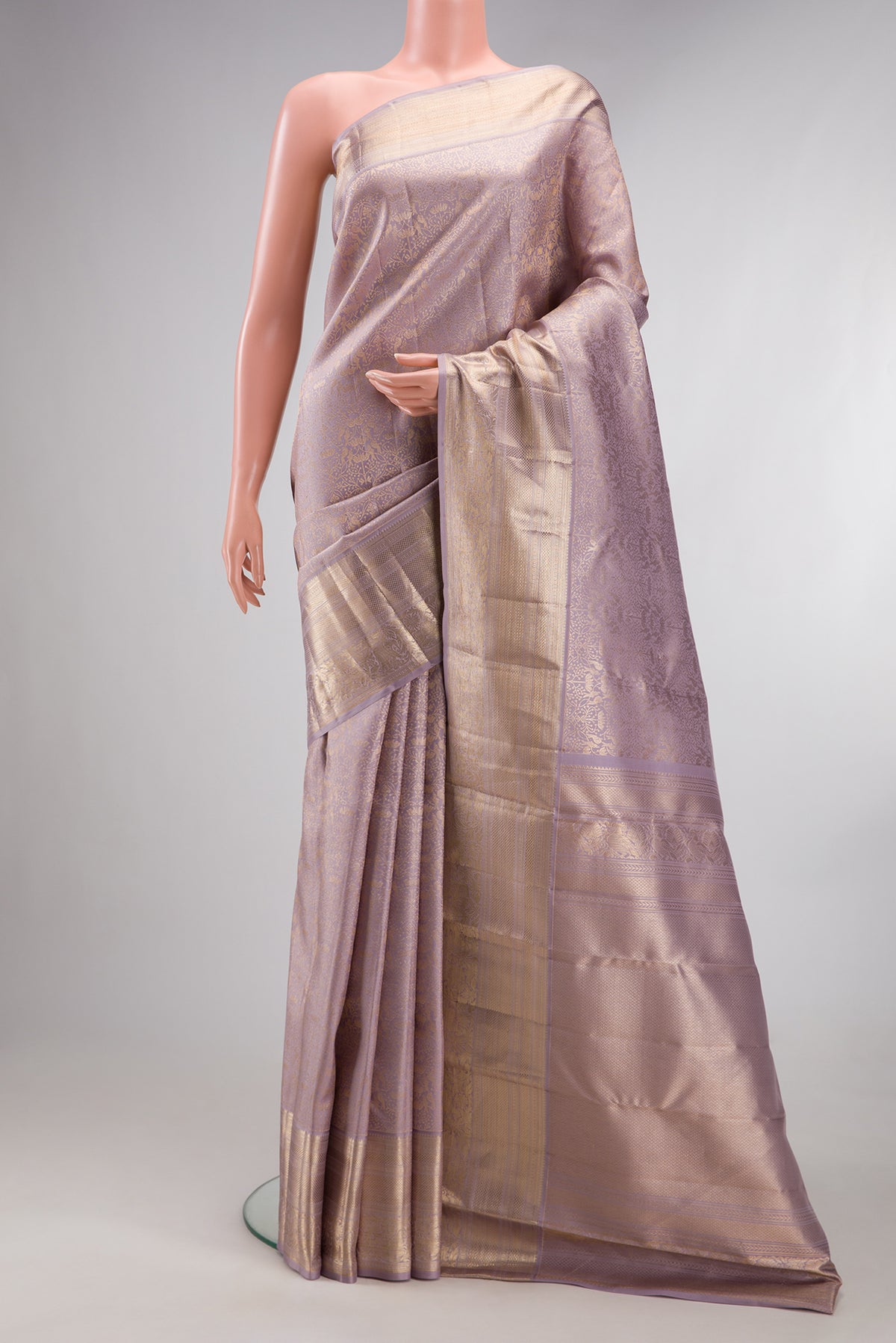 Pure Silk Lilac Dual Tone Kanchipuram Saree with Zari Brocade on the body and Zari Border.  displayed on a mannequin